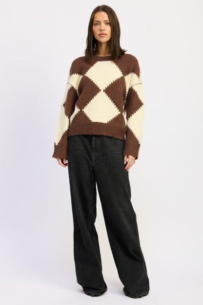 Full body view model wearing Cassidy Sweater with wide-leg black jeans