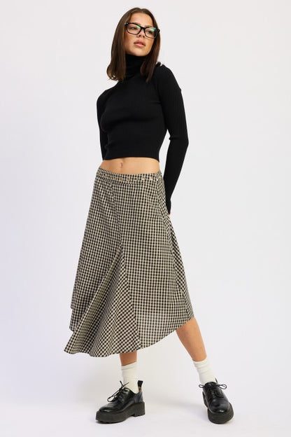 Full body view with black top styled with Karrigan Gingham Asymmetrical Skirt.