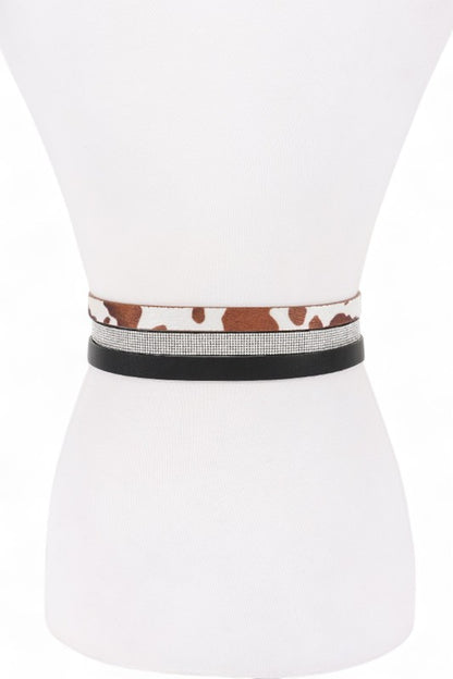 Back view of Dhara Belt Set on mannequin highlighting sleek faux leather straps.