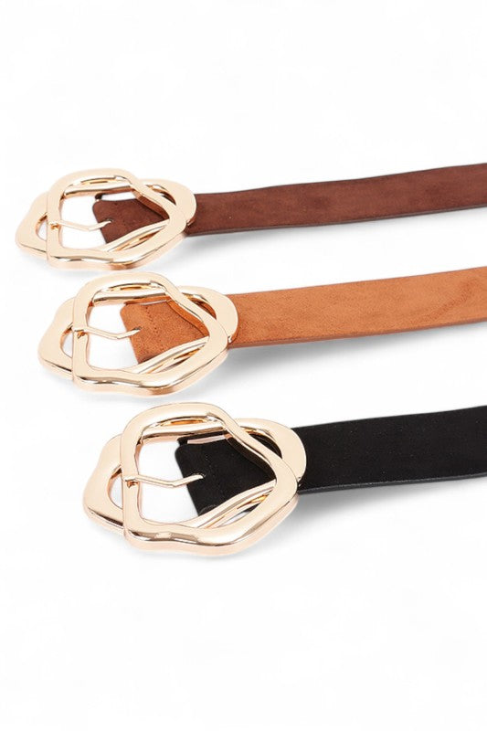 Close-up of Cerisa Twist Belts in black, brown, and camel with bold gold twisted buckle.