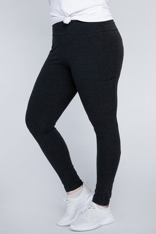 Full-length curvy plus leggings in charcoal with a high-rise thick waistband, fitted silhouette, and convenient leg pockets.