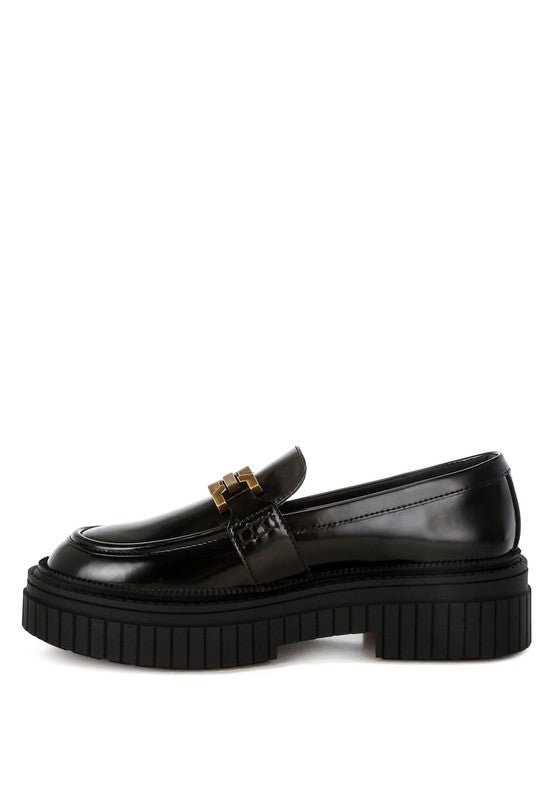 Side view of black Grosbeak Chunky Loafers with ribbed platform heel.