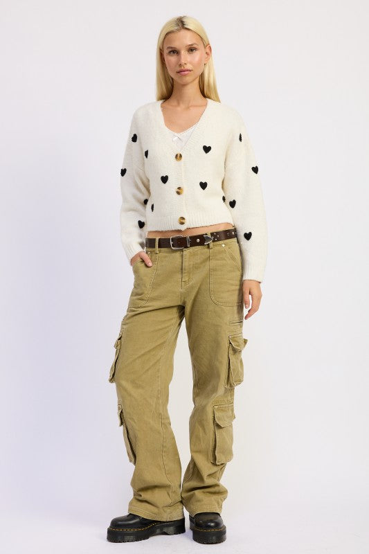 Front view of Donna Cropped Cardigan in ivory and black showing V-neckline and button-down front.