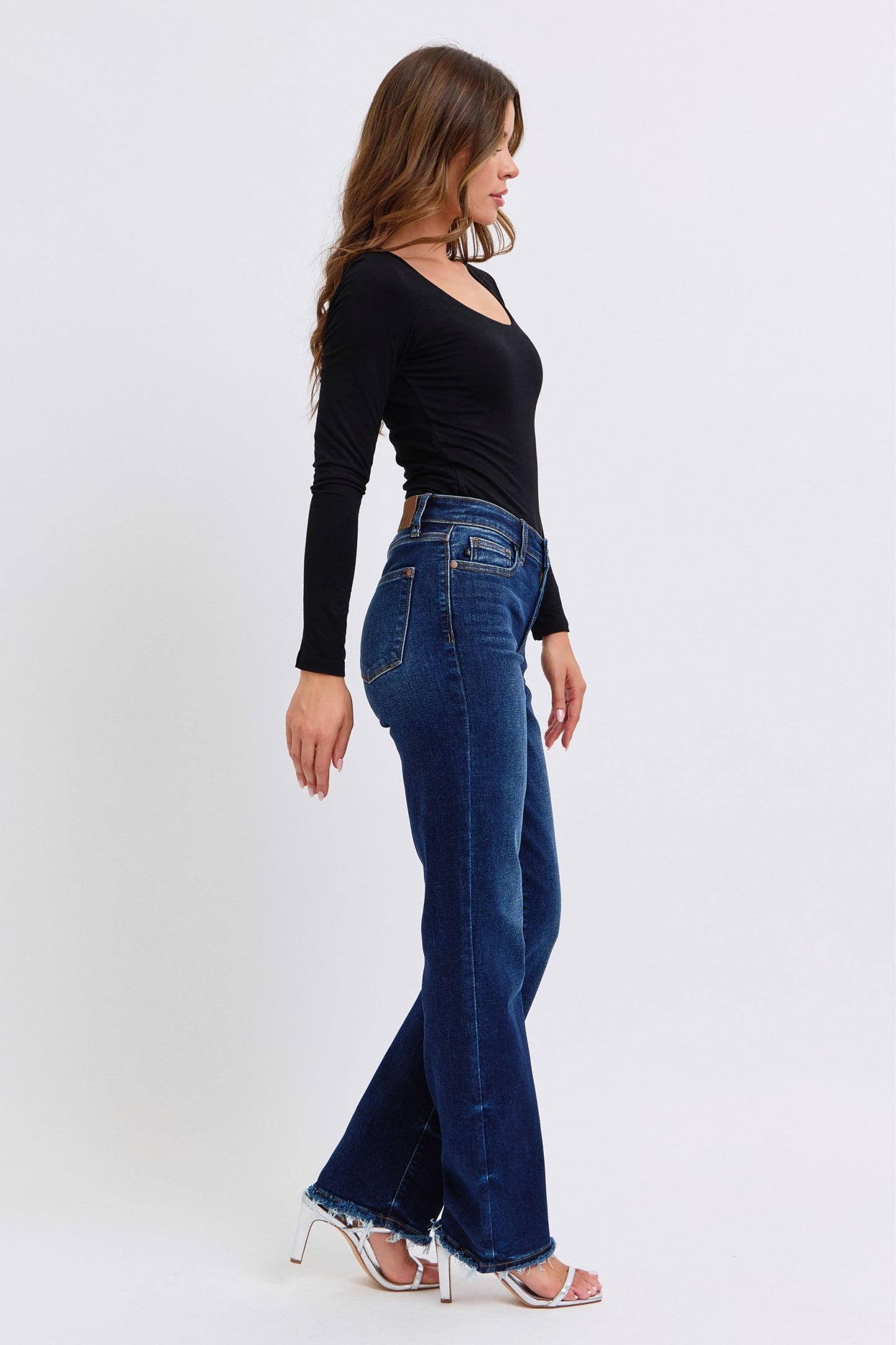 Judy Blue Polly Raw Hem Straight Leg Jeans in dark wash, featuring a mid-rise waist, raw hem, and slightly stretchy fit for a versatile, stylish look.