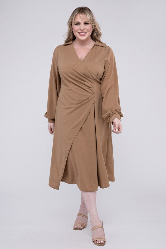 Camel colored wrap dress with twist front detail, collared V-neckline, and bishop sleeves. Features gentle ruching and midi length.