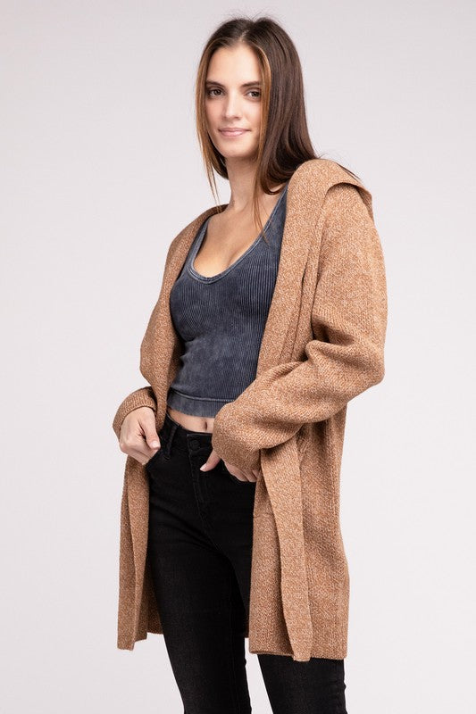 Deep camel sweater cardigan with long sleeves, front pockets, and a hooded neckline. 