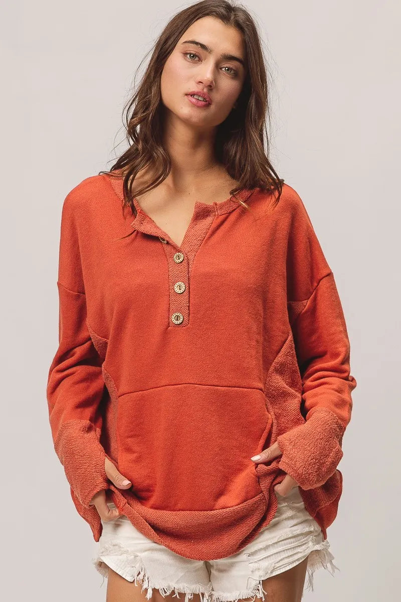 Front view of Hayden Henley showing pocket detail, oversized fit, and French terry knit