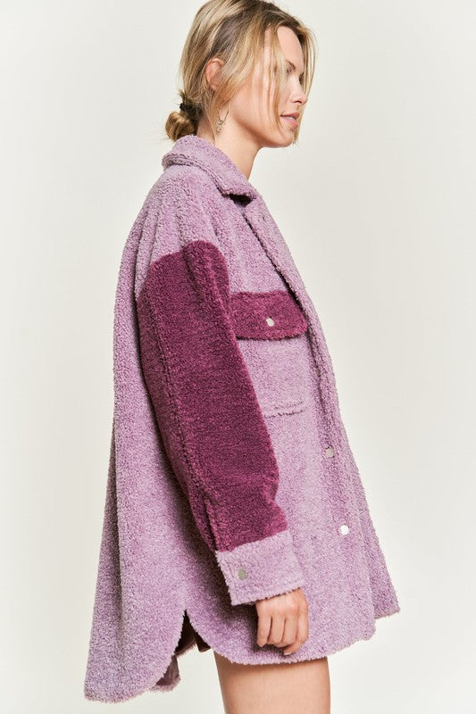 Deedre Sherpa Jacket in berry, close-up side view highlighting sherpa texture and snap buttons.