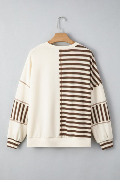 Back of Ariana Stripe Stitched Oversized Sweatshirt on hanger with stripe placement