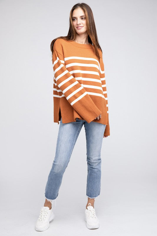 Rust oversized sweater with a ribbed hem and striped pattern, featuring a round neckline and long sleeves.