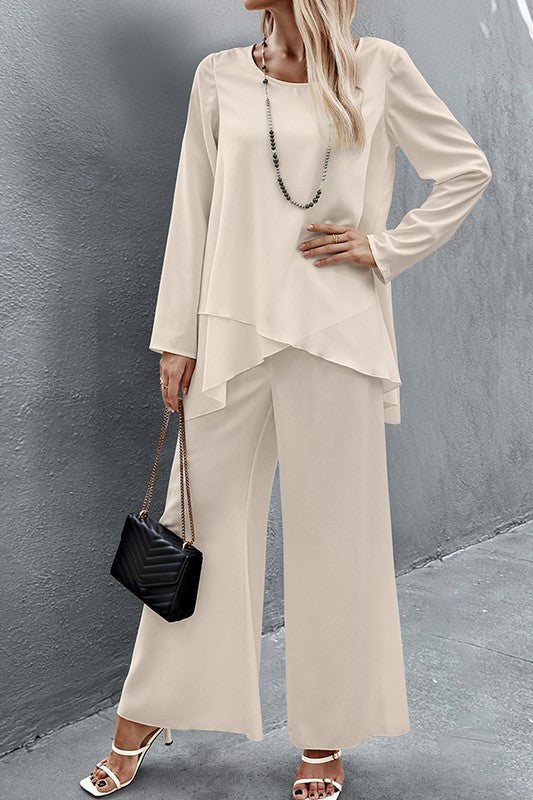 Front view of Nikita Two Piece Set in crème with asymmetry hem blouse and wide leg pants