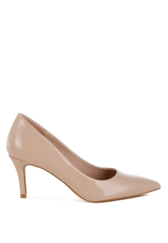 Blush patent leather stiletto heel pumps with a closed point toe. Features a 3-inch stiletto heel, cushioned insole, and made from patent faux leather.