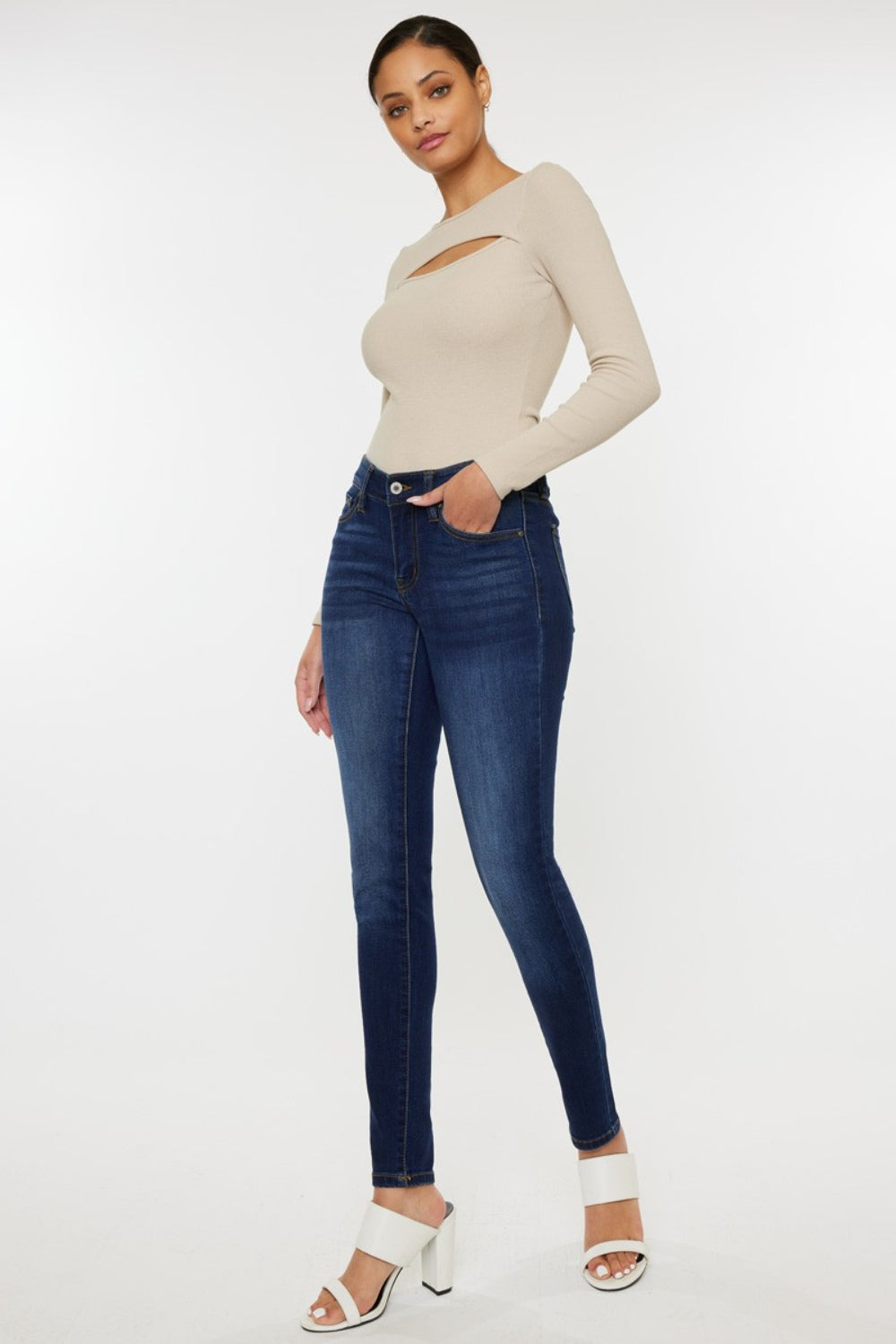 Mid rise gradient skinny jeans with a dark wash. Slightly stretchy, with pockets and a zip fly closure.