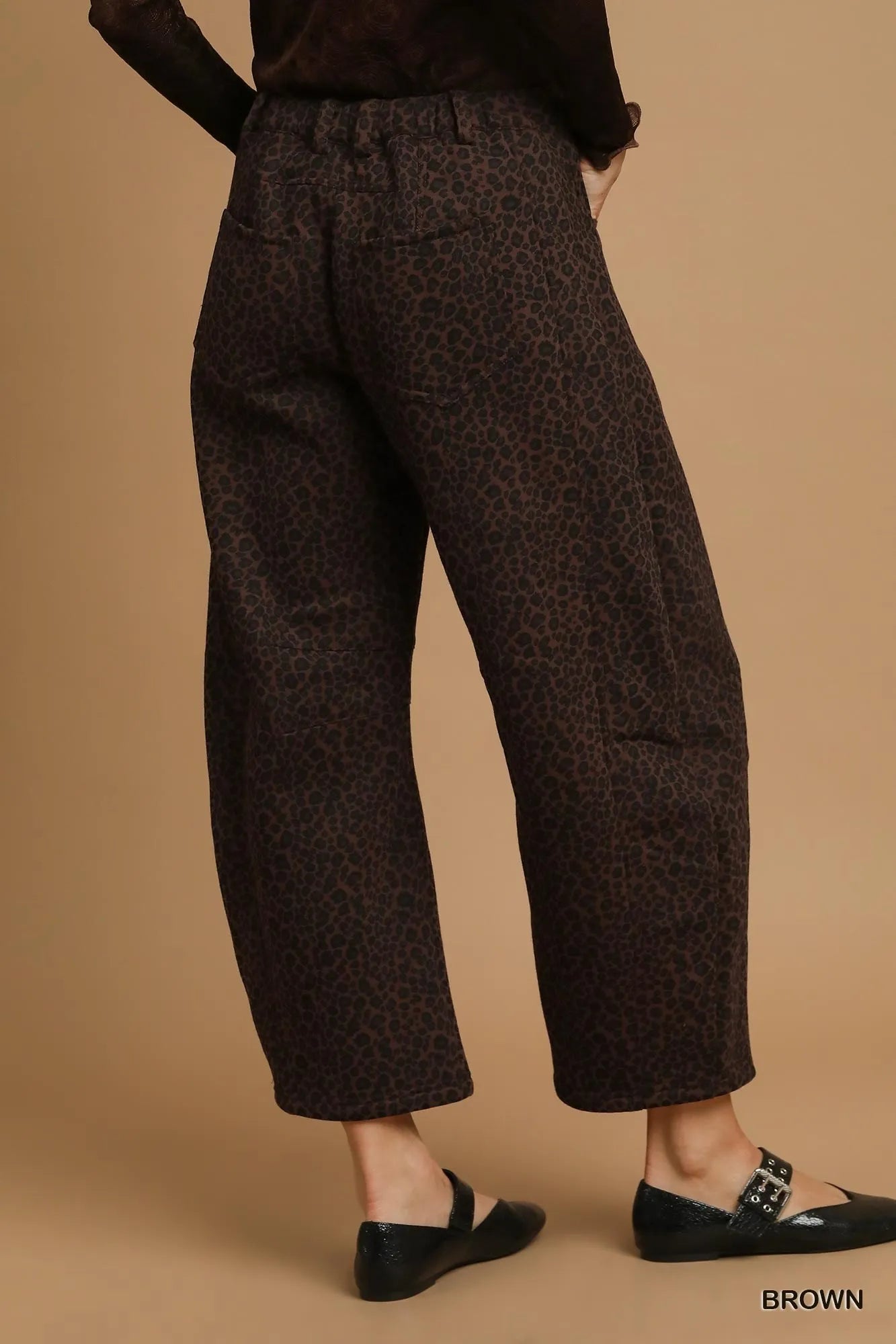 Back view of Finley leopard print pants highlighting flowy cut and relaxed fit.