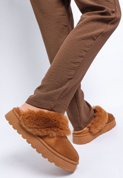Side view of Tan Portho Faux Fur Slip Ons showing microfiber material and sleek shape.