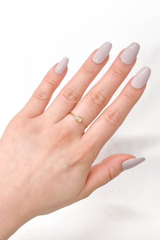 Rectangle Charm Adjustable Ring worn on woman’s hand, minimalist gold design