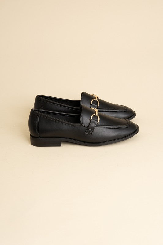 Black Horsebit Loafers with guitar motif, featuring horsebit detailing, slip-on style, and flat heel.