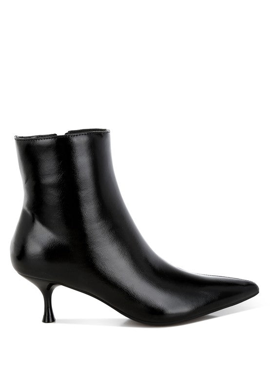 Black faux leather kitten heel boots with a closed point toe, 2.5-inch heel, and zipper fastening. Features paneling detail, elasticated gussets, and comfortable cushioned insoles.