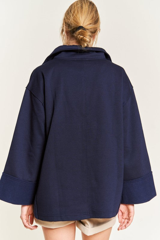 Aylani Plus Size High Collar Knit Top navy close up raw edge detail