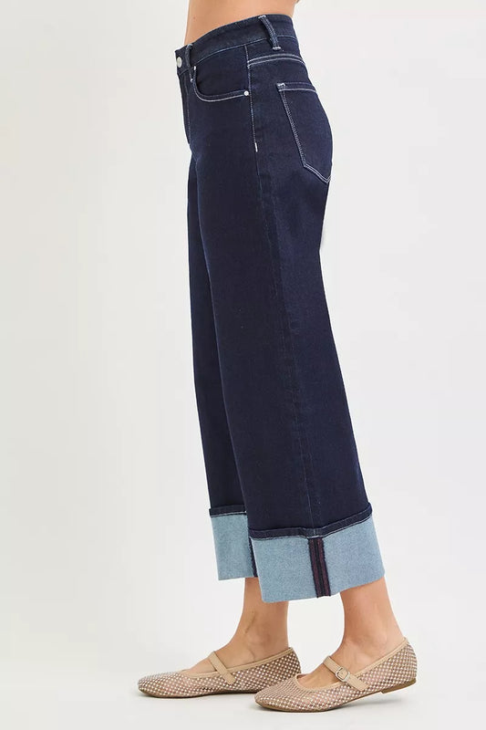 Kaia slouchy barrel jeans side view with dark wash denim and oversized cuffed hems