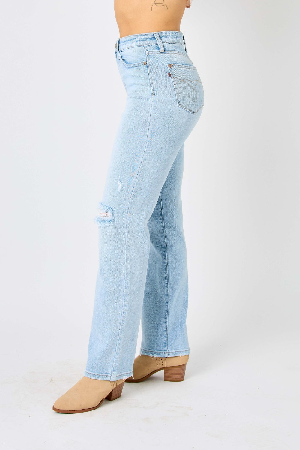 High waist distressed straight jeans in light wash. Slightly stretchy with a zip fly closure.