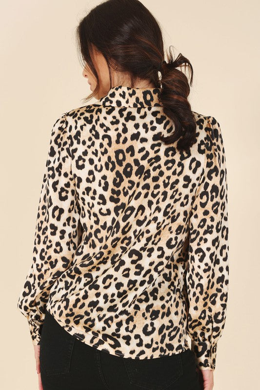 Leopard print satin blouse with a shirt collar, long sleeves, and button-down closure.