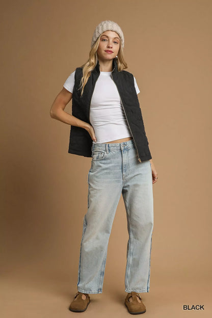 Model wearing Noor Quilted Floral Black Vest with jeans and beanie, full body view