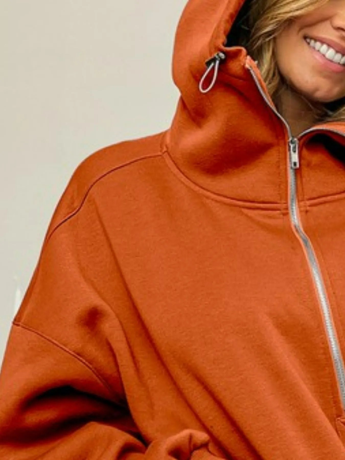 Close-up of the Blaire Fleece Hoodie showing the half zip detail and vintage-washed hooded neckline.
