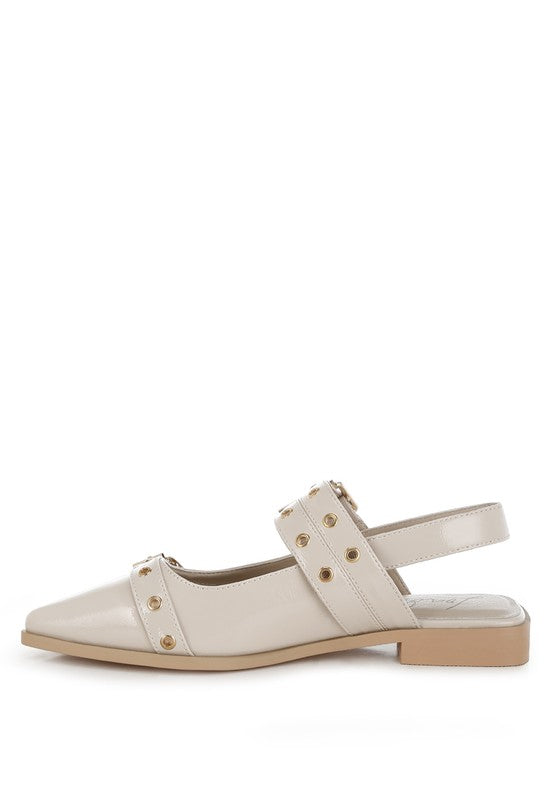 Beige flats with a pointed toe, adjustable buckle straps, eyelet detailing, and a slingback design. Features a cushioned insole and 1-inch flat heel for comfort.