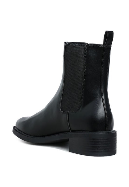 Back angle of Tripoli Stacked Heel Chelsea Boots showing stacked block heel and smooth vegan leather finish.