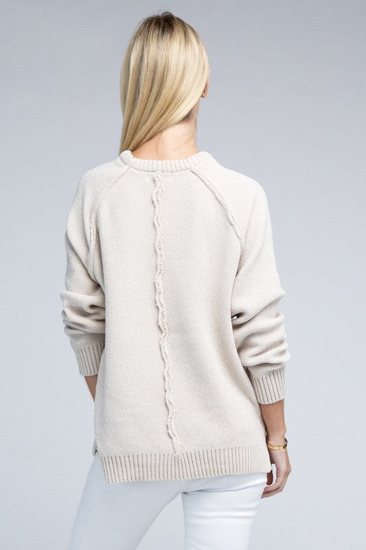 Sand beige round neck chenille sweater with long raglan sleeves, relaxed fit, and hip-length cut.