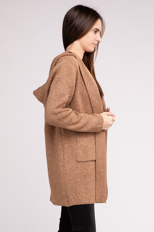 Deep camel sweater cardigan with long sleeves, front pockets, and a hooded neckline. 