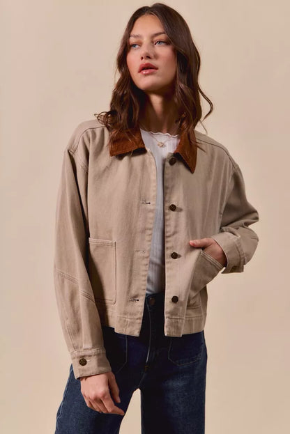 Suri Cotton Twill Cropped Barn Jacket in Taupe displayed open over a white top for layering.