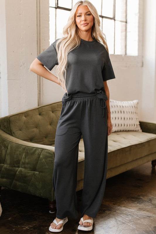 Model styled in Dallas Two-Piece Set, crewneck tee with relaxed wide-leg drawstring pants