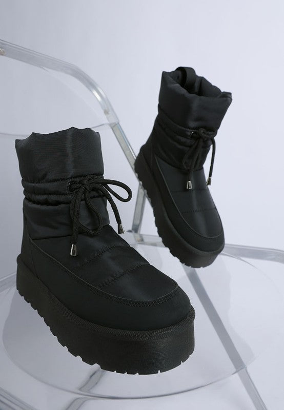 Black Pacos Snow Boots front angle with chunky flatform sole.