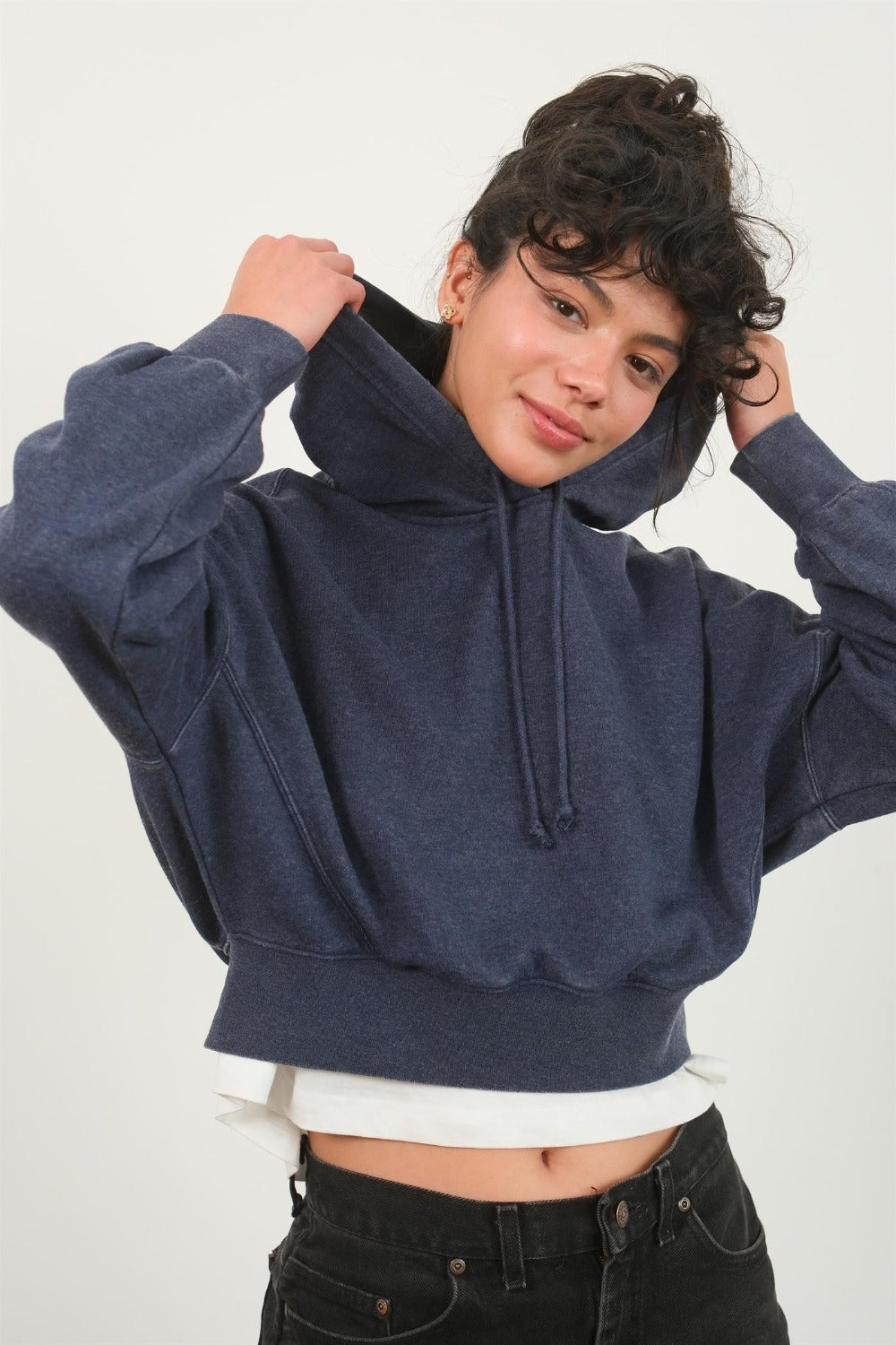 Dark navy cropped hoodie with a hood, drawstring, drop shoulder long sleeves, and a relaxed fit.