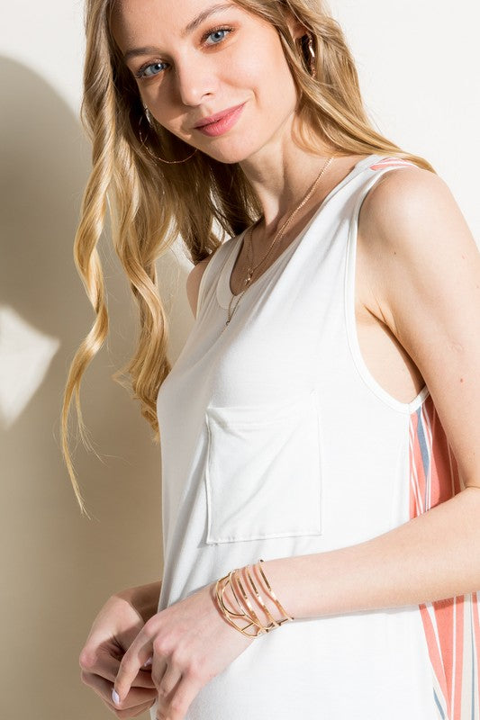 Coral mixed-pattern tank top with a solid white jersey front, a vibrant striped back, a round neckline, and a sleeveless design, featuring a chest pocket.