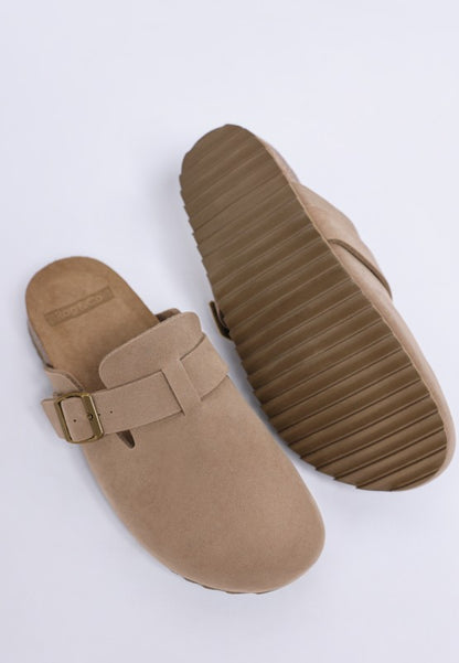 Taupe Ratiha Mules pair with one top view and the other on side showing full tread sole and footbed.
