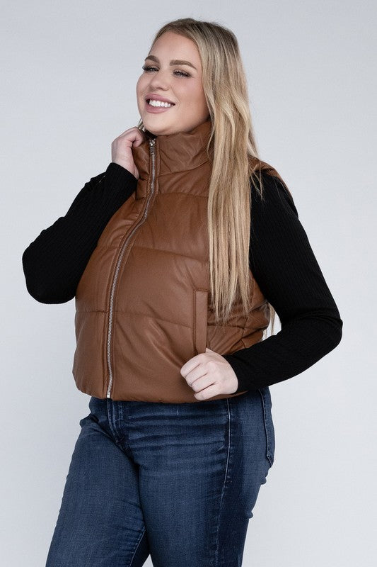 Plus Size Puff Vest in brown, featuring a relaxed fit, zip closure, pockets, and a collar neckline. 