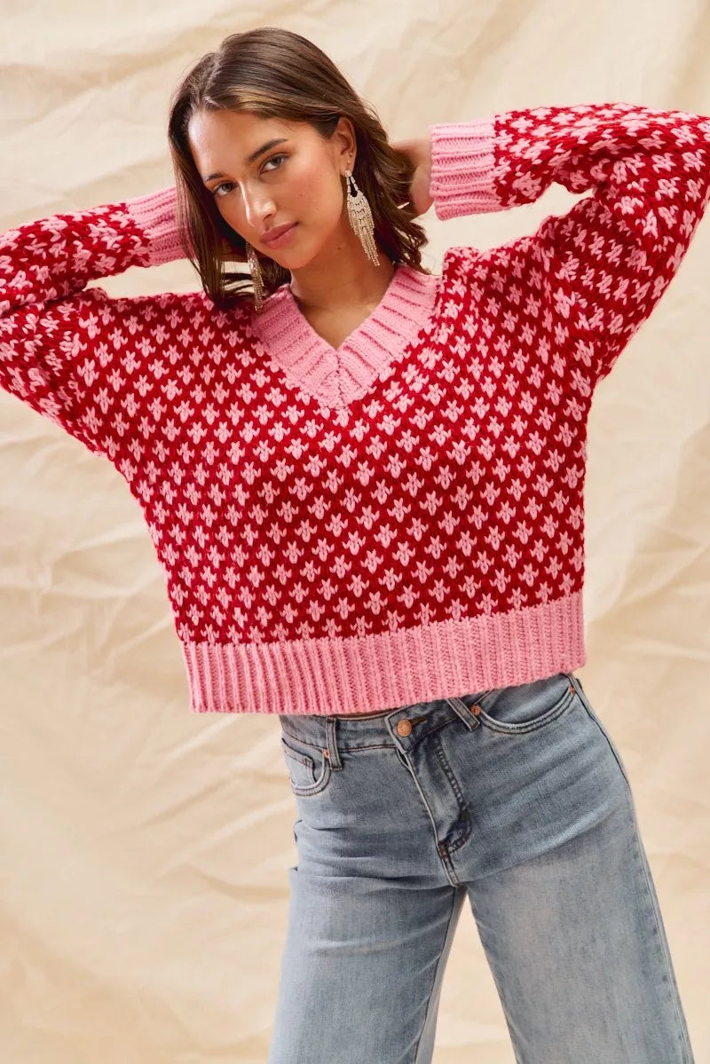 Lifestyle look of Chloe red pink sweater styled with jeans for winter fashion.
