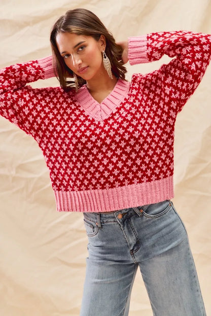 Lifestyle look of Chloe red pink sweater styled with jeans for winter fashion.