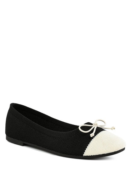 Front angle view of Rosario Two Tone Ballerinas in black and white with bow detail