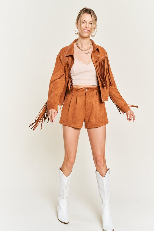 Model wearing Oakley Suede Fringe Jacket in camel with white boots and western vibe.