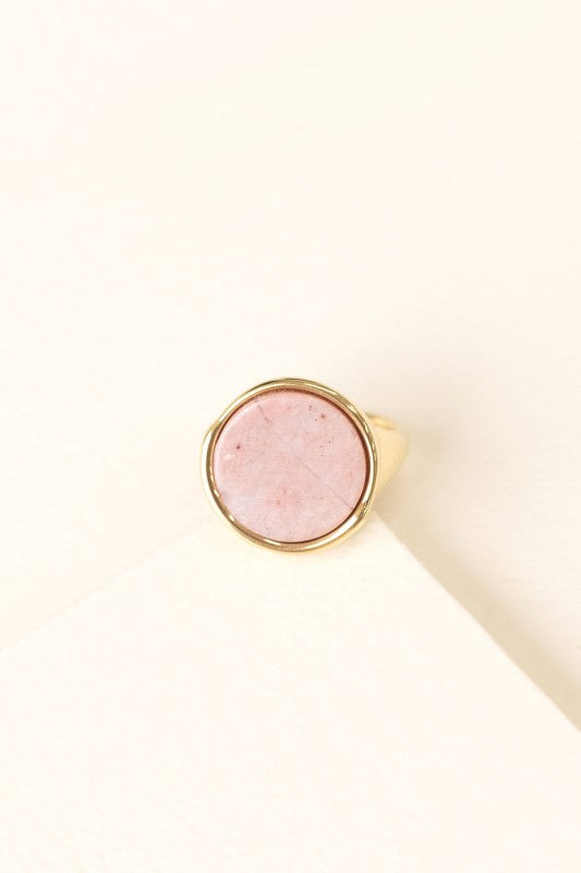 Top view of Ambition Stone Ring in Dusty Rose with round pink-toned stone in gold setting.