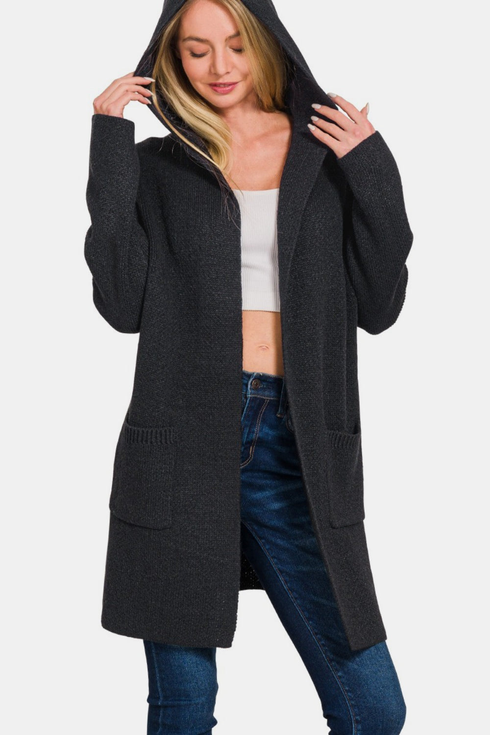 Black woman's cardigan with a hood, long sleeves, and an open front. Features pockets and a slightly stretchy fabric.