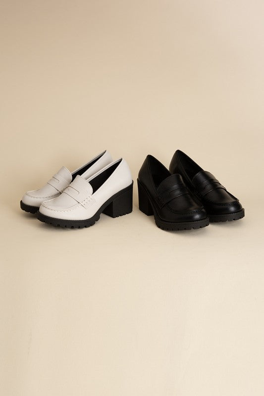 Black and off-white Dewi Block Heel Loafers with a 3-inch block heel.