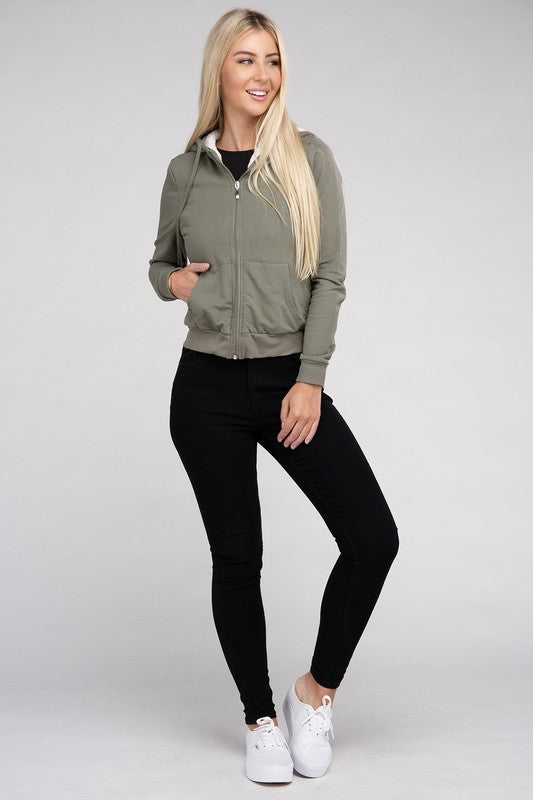 Military green cropped zip-up hoodie with fuzzy trim, pockets, and long sleeves.