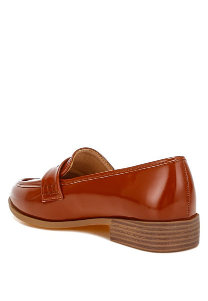 Back angle of Brown Avery Patent Loafers showing flat heel and TPR sole.