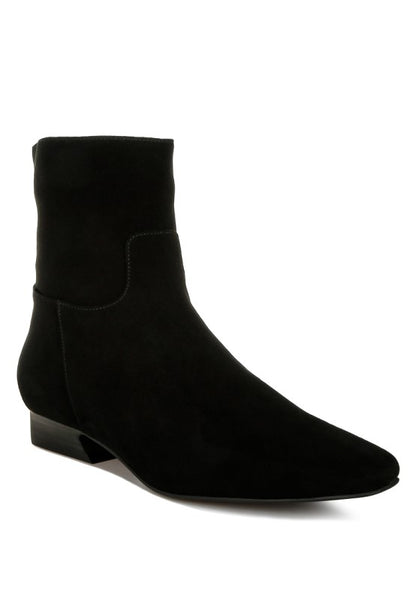 Front angle view of the black Hakra suede boot showing flared low heel, closed almond toe, and suede finish.