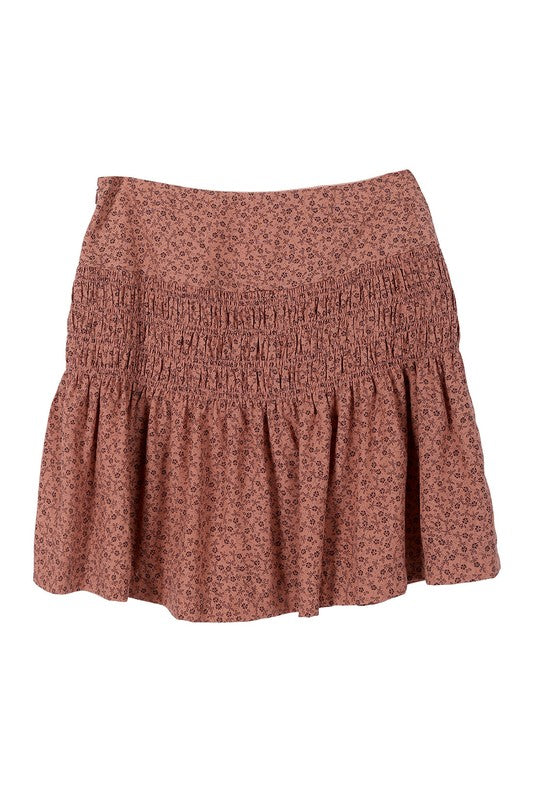 Brown floral smocked skirt with pleats, side zipper, and lining for coverage.